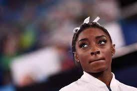 Simone Biles shows support for her fellow athletes by assisting German  gymnasts in securing seats