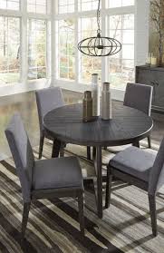 The Besteneer Dark Gray 5 Pc Round Table 4 Upholstered Side Chairs Available At Wcc Furniture Round Dining Room Table Grey Dining Tables Round Dining Room