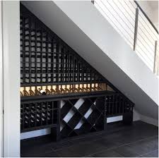 Under stairs wine cellar adding a wine cellar underneath the staircase was a good use of space, but also an interesting and beautiful design component under stairs wine cellar. Why Is A Homeowner Making A Wine Cellar Under The Stairs Coastal Custom Wine Cellars Coastal Custom Wine Cellars