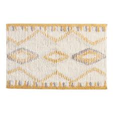 As well as this charcoal grey option, it's available in shades of blue, purple, and in more neutral tones of beige, white, and sage. Ivory And Mustard Boho Shag Bath Mat Yellow By World Market In 2021 Shag Bath Mat Bath Rugs Yellow Bath Rugs