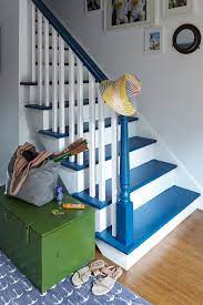 We love how on this staircase, the wood has been left bare in the centre and just pops of yellows have been painted onto the edges. 18 Pretty Painted Stairs How To Paint Stair Rails Risers And More