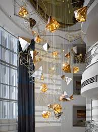 The Biggest Lighting Installation In The Sheraton Dubai Mall Of The Emirates Hotel Is Located In The Lob Ceiling Lamp Design Hotel Light Modern Interior Design