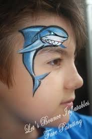 Clown fish face paint is fun for an outdoor movie party featuring ...