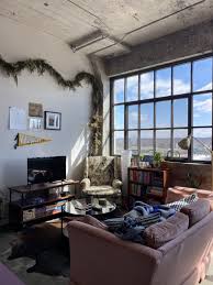 A 700 Square Foot Apartment S 15 Pink Couch Is Just One Of Its Great Vintage Finds Big Windows Living Room Pink Couch Apartment Living Room