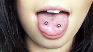 Two small piercings on both sides of the tongue located closer to the tip. What Is Frog Eyes Piercing Procedure Cost And Aftercare Tips Journal Reporter