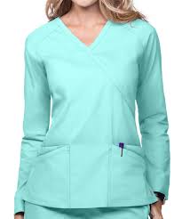 More brands are introducing fitted scrubs and ones with nice detailing like cut outs at the neckline, laser cut detailing, and even some moto detailing. Butter Soft Scrubs By Ua Long Sleeve Mock Wrap Top Gulf Stream Scrub Tops Medical Scrubs Fashion Stylish Scrubs
