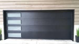 If you need a double garage door, the typical measurement is 16 ft. Chi 417 Black Flush Door With Vertical Windows Los Angeles Ca Photo Credit Agi Dyer Garagedoors Gara Garage Doors Modern Garage Doors Garage Door Design