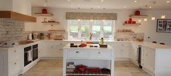 'the key is to use sleek handleless cabinets and a rich and authentic combination of materials and textures to create a really interesting and elegant scheme. The Year 2020 In Kitchen Design Seymour Kitchens