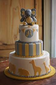 Yellow And Grey Animal Themed Baby Shower Cake With Fondant Elephant Topper Elephant Baby Shower Theme Elephant Baby Shower Cake Baby Shower Cakes For Boys
