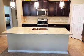A tiered kitchen island can create clear zones for prep, cleaning, cooking, and dining. 3 Benefits Of Kitchen Island Countertops Countertops More Com