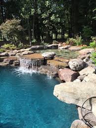 Pool Waterfall Ideas You Can Recreate In Your Backyard Decor Around The World In 2020 Pool Waterfall Pool Waterfall Diy Pool Landscaping
