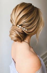 If you're going for a traditional look for your wedding reception there's probably no better hairstyle than a floral bun. 100 Prettiest Wedding Hairstyles For Ceremony Reception