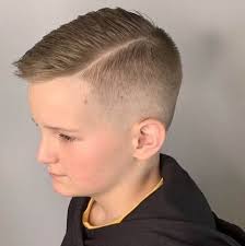 The comb over is easy to maintain and will make your son look like the coolest kid in school. Textured Side Swept Hairstyle With High Fade Boy Haircuts Short Short Hair For Boys Boys Fade Haircut