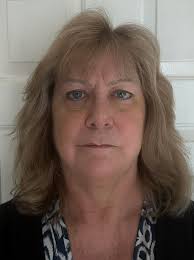 Would someone be able to change the background to plain please? The  passport office don't like it!