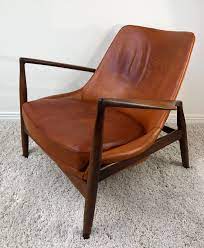 This chair has a solid teak frame and is newly upholstered with turquoise upholstery. Ib Kofod Larsen Salen Easy Chair With Teak Frame Cognac Leather 1950 S 155297