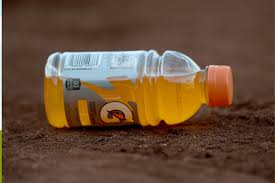 A shelf display of Gatorade bottles with a focus on 28-ounce packaging