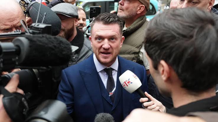 Tommy Robinson refused to give police phone Pin to protect 'journalistic material' - BBC News