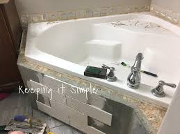 Kitchen with custom cabinets, tiled backsplash and new appliances and countertops. Tips On How To Tile A Corner Bathtub Using Wavecrest And Venatino Linear Mosaic Tiles Keeping It Simple