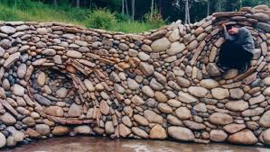 Plan out the wall's height and base thickness. The Art Of The Dry Stack Stone Wall Insteading
