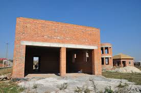 Adobe bricks earth building is an ancient technique. Building Construction Brick Garage For Two Cars Unfinished Garage Construction Building Garage Stock Photo Adobe Stock