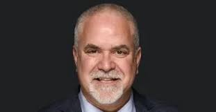 What did Warren Township High School District 121 teacher Thomas W. Witek  earn before leaving school?