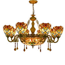 A good rule of thumb for dining room chandeliers is to hang them so that the bottom of the chandelier will hang 30 inches to 36 inches above the table. European Luxury Creative Classic Baroque Living Room Dining Room Crystal Chandelier Tiffany Retro Color Glass Lamp Buy Lighting Modern Pendant Light Chandelier Boule De Cristal Chandelier Luxury Lighting Chandelier Product On Alibaba Com
