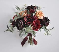Traditionally bridesmaids carry flower bouquets with them down the aisle and hold them throughout the ceremony and for group pictures. Burgundy Wedding Bouquet Wedding Flowers Bridal Flowers Etsy In 2021 Silk Flower Wedding Bouquet Fresh Wedding Flowers Wedding Flower Design