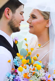 I present to you Mr. & Mrs. Scroggins. July 13th, 2024 was a day full of  love, laughter, so much emotion, and of course all the colors. This couple  is surrounded by