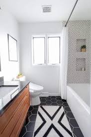 You can use elegant white containers for shampoos and conditioners, feature a shower enclosure in frosted white glass, or store all of your shower and bath accessories in hanging white racks. Modern Black And White Bathroom Bright Green Door