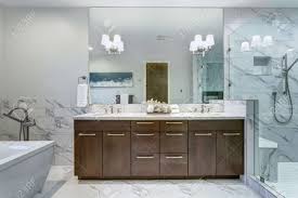 Walk in shower ideas on a budget. Incredible Master Bathroom With Carrara Marble Tile Surround Stock Photo Picture And Royalty Free Image Image 96675017