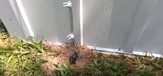 How do you secure a metal shed to the ground?