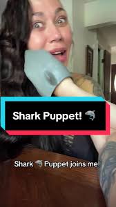 People Playing with Shark Puppets