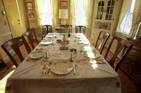 A round glass dining table set is an elegant option for an updated outdoor kitchen. Dinner Table Set In Dining Room Stock Photo Dissolve