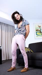 Black And Pink Floral Shirt Mens Pink Pants With A Floral Print Shirt Tan Shoes And Long Hair For Men Long Hair Styles Men Pants Outfit Men Pink Pants Outfit