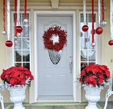 Collect your kids' old rain boots, an umbrella, or a watering can along with faux flowers and ribbon. 57 Stunning Christmas Front Door Decor Ideas Digsdigs