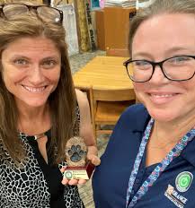 Ms. Killkelly Passes the PAW to Mrs. Danielle Schmidt! "Thank you for  helping us get ourselves and all these students tested over the last week.  Your organization and communication was pawsitivley phenomenal!This