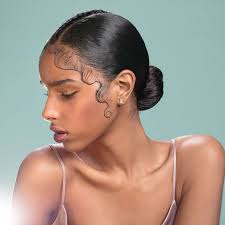 Pull your hair up into a loose bun or ponytail, leaving your baby hairs on display. Middle Part Low Bun With Long Baby Hair Black Hair Tribe