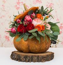 Vibrant Pumpkin Vases With Flower Arrangements Thanksgiving Table Centerpiece Ideas In 2020 Pumpkin Vase Pumpkin Floral Arrangements Thanksgiving Flowers