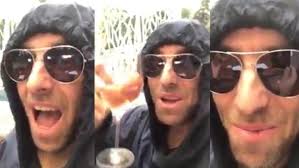 Liam Gallagher drinking wine and singing in a posh voice