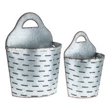 Simply place a metal wire basket on the floor next to your sofa and fill it with blankets to get a comfy storage; Slotted Metal Wall Basket Set Hobby Lobby 1454586