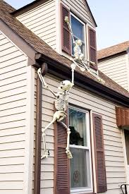 Skeleton Hanging From House Halloween Skeletons Outdoor Halloween Easy Outdoor Halloween Decorations