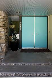 Read on for a few features you're likely to find on today's. How Mid Century Turquoise Doors In Love Secret Design Studio Knows Mid Century Modern Architect Mid Century Modern Exterior Turquoise Door Mid Century House