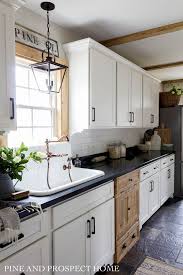 Learn how to hang wall cabinets to frees up counter space, add additional storage space and improve the look and functionality of your kitchen. A New High Back Sink And Faucet In Our Cottage Kitchen Old Farmhouse Kitchen Cottage Style Kitchen One Wall Kitchen
