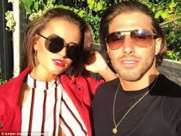 Amber Davies and Kem Cetinay look loved up leaving ITV set