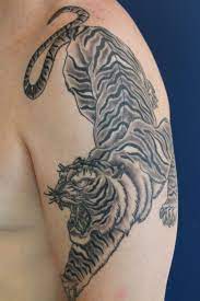 12 Black And Grey Tiger Tattoo Designs Petpress Tiger Tattoo Design Tiger Forearm Tattoo Tiger Shoulder Tattoo