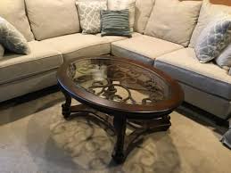 The norcastle oval coffee table deserves a toast for incorporating so many elements so seamlessly. Signature Design By Ashley Norcastle Oval Coffee Table Big Lots