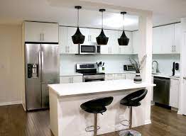 Modern Kitchen With Hardwood Floors Black Pendant Lighting White Cabinets Stainless Steel Hardwood Floors In Kitchen Kitchen Tiles Design Red Kitchen Decor