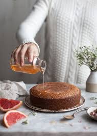 This crumbly semolina cake is perfectly moist with the addition of figs and yogurt. Semolina Cake Rose Grapefruit Syrup Semolina Cake Desserts Dessert Recipes