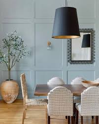 Photo about grey dining room interior with pink and blue painting, wooden table and chest of drawers. Farrow Ball Us Pigeon A Strong Blue Grey For A Divine Dining Room Buy Your Sample Pot Https F B Ltd 2q37mfk Facebook