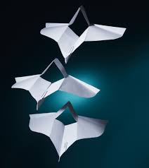 Fold the right and left folded edges again to the center of the paper. How To Make The Perfect Paper Airplane